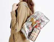 Trenchcoat by Slow and Steady Wins the Race worn with Ed Hardy bag and Burberry wallet.