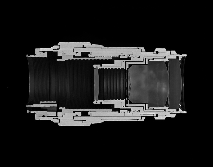 Christopher Williams Cutaway model Leica Leitz Wetzlar Tele-Elmar 135/4.0 Focal length: 135 mm Aperture range: 4 – 22 Number of elements/groups: 4/4 Focusing range: 1.5 m – infinity Angle of range: 18 degrees Filter thread: 39 mm Weight: 405 g Dimensions: 53.4 × 122.69 mm Manufacturer part number: 11850 Lens design by Dr. Walter Mandler Manufactured by Ernst Leitz GmbH, Wetzlar, Germany Studio Rhein Verlag, Düsseldorf March 14, 2013, 2014 Selenium toned gelatin silver print 14 1/2 x 18 1/2 inches (36.8 x 47 cm) Courtesy David Zwirner, New York/London and Galerie Gisela Capitain, Cologne.
